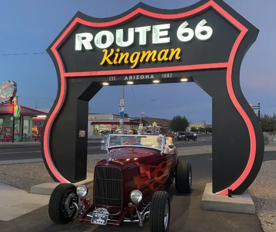 Route 66 Kingman sign and classic car